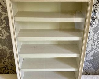 White wooden display case with glass door