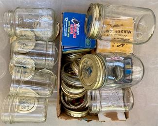 Assorted blue and clear Ball Mason jars with canning lids; canning supplies