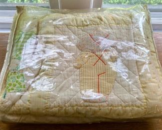 Various quilts, from patchwork and hand-sewn to modern