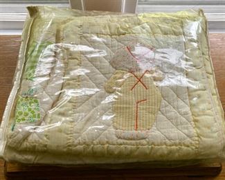 Various quilts, from patchwork and hand-sewn to modern