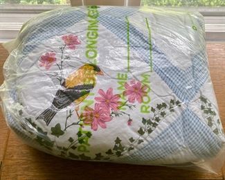 Various quilts, from patchwork and hand-sewn to modern