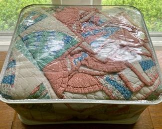 Various quilts, from patchwork and hand-sewn to modern