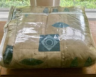 Various quilts, from patchwork and hand-sewn to modern