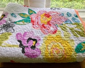 Various quilts, from patchwork and hand-sewn to modern