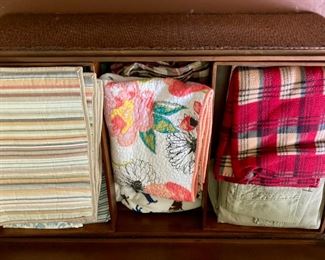 Various blankets, throws and bedding, from hand-sewn to modern