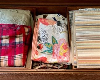 Various blankets, throws and bedding, from hand-sewn to modern