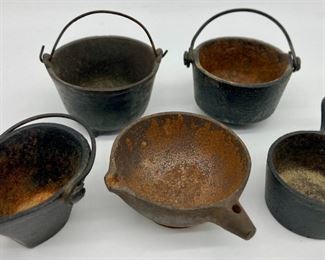 Vintage cast iron buckets and pots