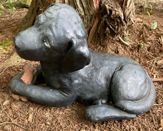 Black metal puppy with bone lawn ornament