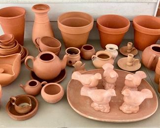 Assorted terra cotta pots, vases, birds, bowls, candlestick holders, votive candle holders, teapots