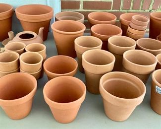 Assorted terra cotta pots, vases, birds, bowls, candlestick holders, votive candle holders, teapots