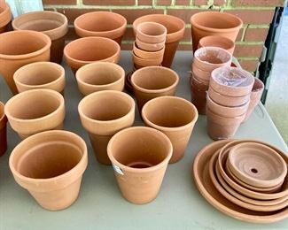 Assorted terra cotta pots, vases, birds, bowls, candlestick holders, votive candle holders, teapots