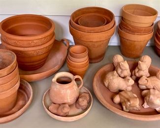 Assorted terra cotta pots, vases, birds, bowls, candlestick holders, votive candle holders, teapots, squirrels, frogs