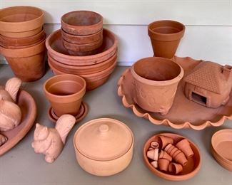 Assorted terra cotta pots, vases, birds, bowls, candlestick holders, votive candle holders, teapots, squirrels, frogs