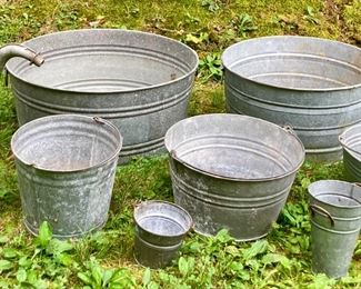 Assorted galvanized buckets, watering cans