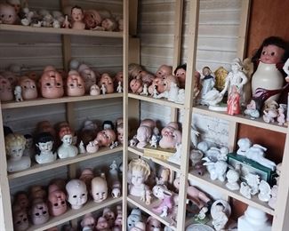 Doll heads...lots of doll heads. Great for projects like finishing them out, planters, and Halloween.