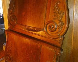 Bed with carved griffin decoration. There is a matching wash stand and dresser. Both have mirrors.