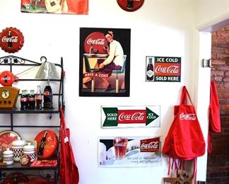 Look at all the Coca Cola metal signs