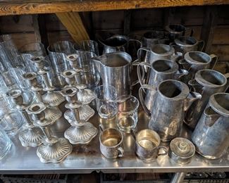 Silver plate pitchers and candle holders