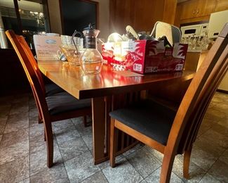 Danish teak dining room set with under table leaf extensions 