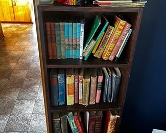Vintage books and cast iron piggy bank