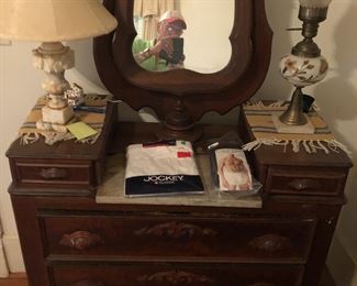 Antique dresser with wooden polls. 40x19 x 40 tall. Mirror adds 36 “ to height