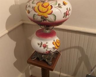 Hand painted hurricane lamp with brass base. 27 “ tall. Stand is one of pair -10x10 x27 tall
