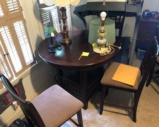 Tall dining table with 4 chairs. 43 “diameter, 36 tall