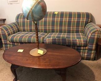Plaid sofa with matching love seat-68 “ wide. Oval coffee table 47 x 28 x17 high.  Replige world nation series globe. 
