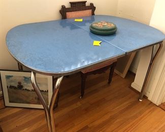 Vintage blue Formica top table.  49” x 34”. No chairs!