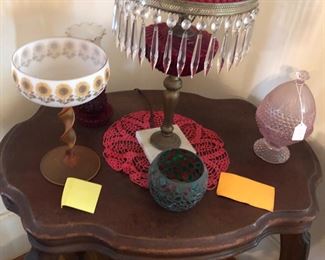 Red lamp with 34 glass prisms. Cranberry glass shade.  1930’s radio table. 33x23 x 29 tall