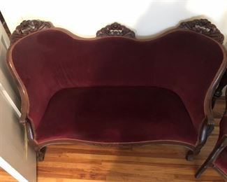 Red velvet loveseat. Seat is 38”. Back is 53” across. Another similar loveseat also in sale