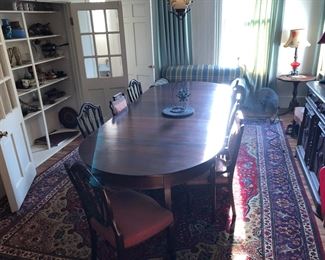 Dining table has 3 leaves to extend to 120” x 48 wide.  8 shield chairs to complete set
Rug is 9x14