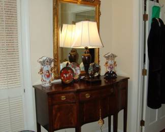 Gold gilded figural mirror and mahogany hunt board