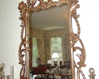 One of Pair decorative mirrors