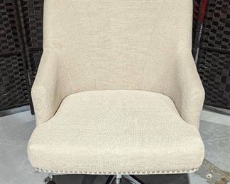 Upholstered Swivel Chai with nailhead Trim Accent