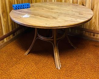 Bottom is rattan. She’s keeping the matching rattan chairs. 