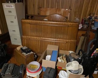 More stuff. File cabinet old bed 