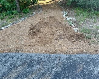 Use this pathway to the house. It is before the driveway.