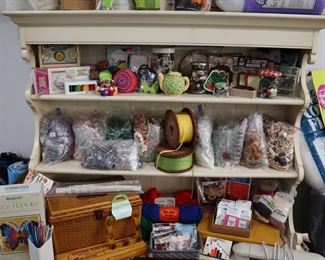 Craft and sewing totes, along with knitting needles, crochet needles, rug yarn, pin cushions, etc.