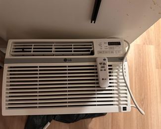 LG 8000 BTU AC with remote. Quiet and runs like a dream.  