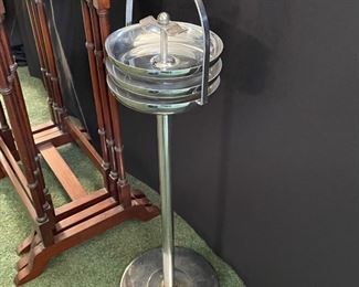 Chrome standing ash tray.