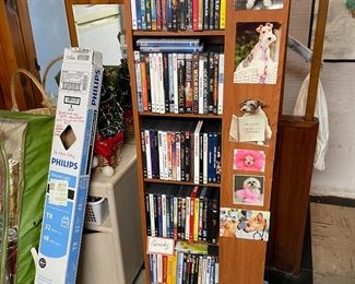 Bookcase turns all 4 sides filled with movies.