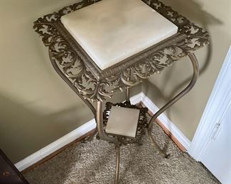 Plant stand with marble.