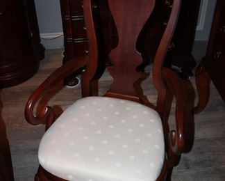 two arm chairs and six side