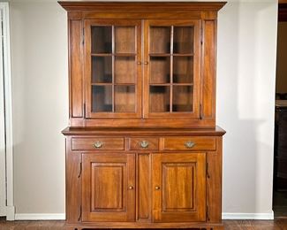 Step back Cupboard | 20th century, having double glazed doors over three drawers, over double cabinet doors, with hammered iron decorative hinges. - l. 57 x w. 19 x h. 82 in