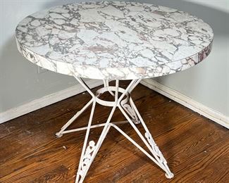 Mid-Century Style Table | Patterned composite top on a quadruped wrought iron base with scrolling floral legs. - h. 30 x dia. 36 in