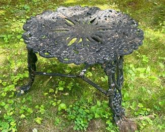 Wrought Iron Table | Wrought iron garden / patio side table in black with grapevine motifs composing the tabletop and three legs. - h. 14 x dia. 19 in