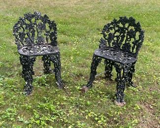 Pair Wrought Iron Chairs | Two small wrought iron garden chairs with grapevine motifs composing the openwork seats, seat backs, and legs. - l. 16 x w. 13 x h. 26 in