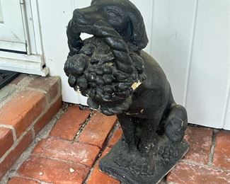 Dog Lawn Ornament | Labrador statue welcoming visitors with a basket of fruit; stone or cement painted black. - h. 23 in