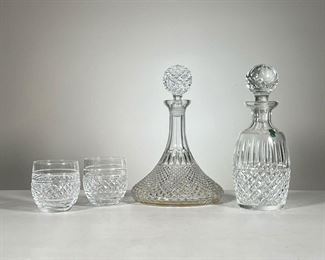(4pc) Crystal Liquor Set | Two large decanters, one with Waterford acid mark, and a pair of glass tumblers each with Waterford acid mark. - h. 10.5 x dia. 4 in (Waterford decanter)